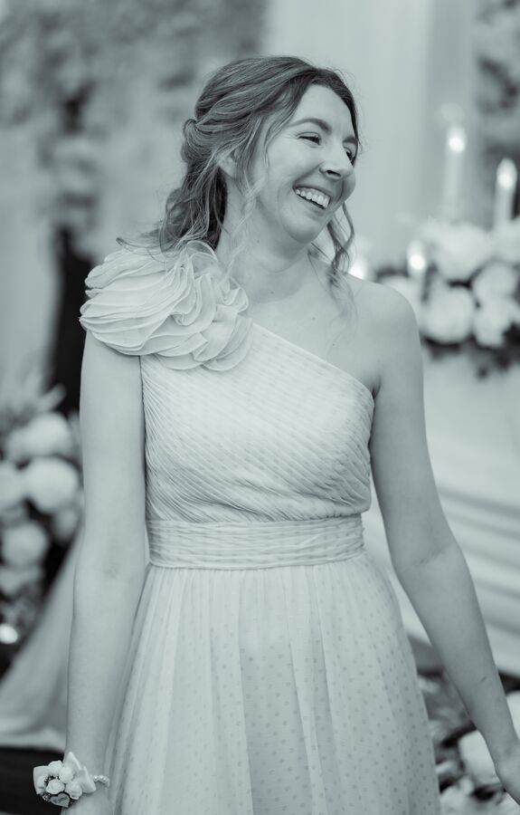 Guest laughing during a wedding ceremony