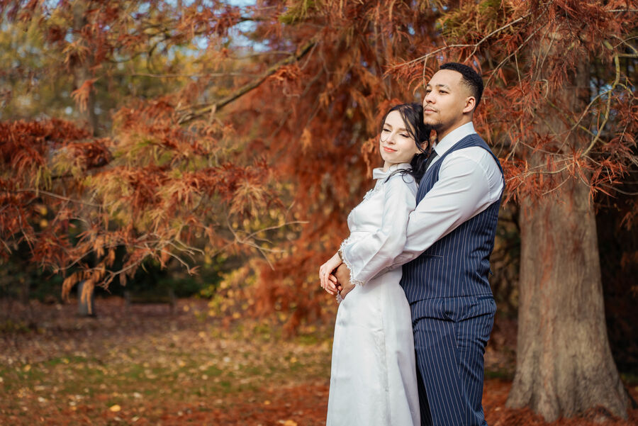 Engagement photoshoot in Europe — couple under autumn trees