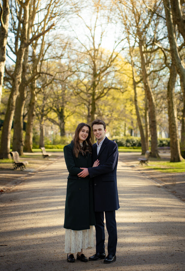 Couple portrait on a tree-lined park avenue in Brussels