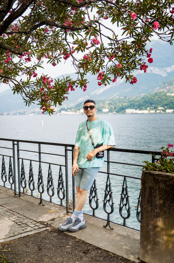 Solo portrait session of a man by the waterfront at Lake Como, Italy
